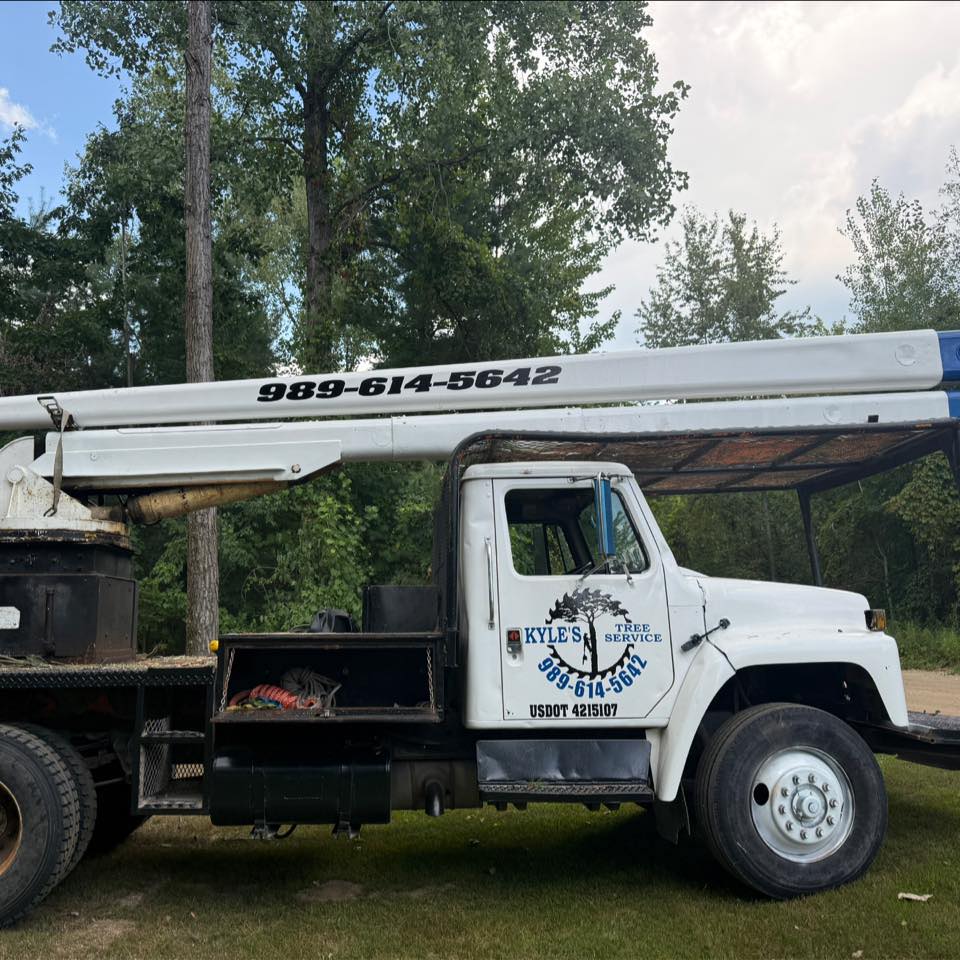 A side profile of the work truck for Kyle's Tree Service